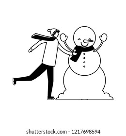 man with winter clothes and snowman
