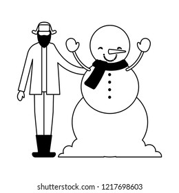 man with winter clothes and snowman