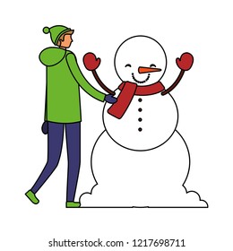man with winter clothes and snowman