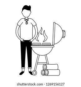 man withbarbecue grill sausages and wooden