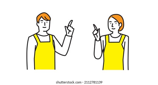 A man and a woman in aprons pointing upward and giving directions.