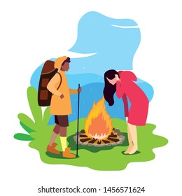 man and woman with bonfire camping hiking landscape