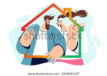 Man and woman bought house with mortgage hold contour of cottage together and encourage to invest in real estate. Couple is happy about mortgage and buying own home or renting property in elite area