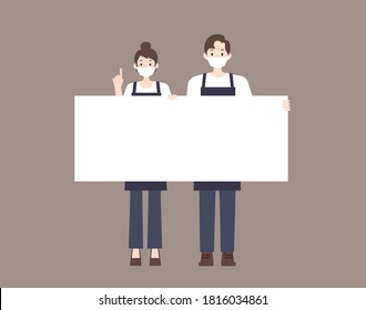 Man and woman couple wearing masks and aprons. I am holding an empty board.