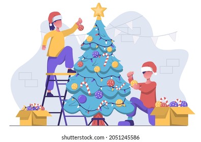 A man and woman decorating the Christmas tree with toys, New year atmosphere