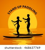 Man and woman do stand up paddling on water at sunset. Couple paddleboard surfing silhouette