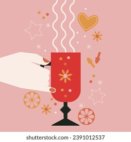 Man or woman hand holding mulled wine glass. Warm winter drink with steam. Winter season abstract art. Festive cocktail, spices, orange fruit slice, gingerbread cookies. Christmas holiday party poster