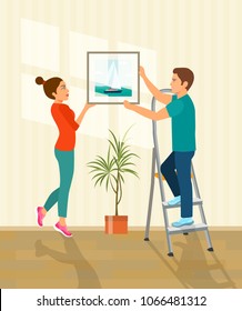 Man and woman hanging picture on the wall.  Vector flat style illustration