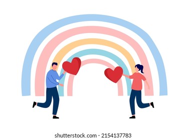 Man and woman holding red heart with rainbow on background. Cheerful couple dating. Kindness or generosity.
