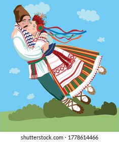Man and woman hugging each other in Ukrainian national costumes
