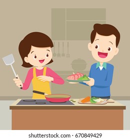 Man and Woman in the kitchen.Husband and Wife are preparing together so happy.