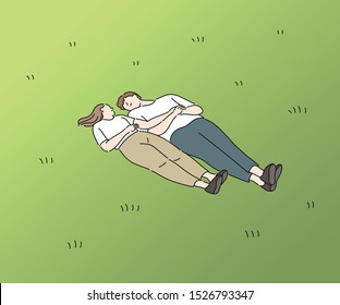 A man and a woman are lying comfortably on the lawn, looking at each other. hand drawn style vector design illustrations. 