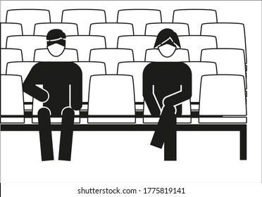 Man and woman in medical masks, keeping social distance in the theater