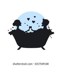 man and woman, romantic couple in love in a bathtub taking bubbled bath silhouette