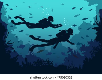 Man and woman scuba divers silhouette swimming in deep sea. Underwater Background with coral reefs and fishes