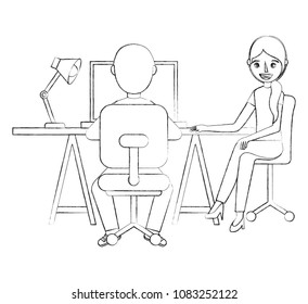 man and woman sitting at the desk and working on the computer