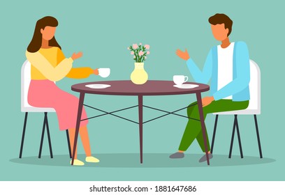 Man and woman sitting at the table with coffee in restaurant. Married couple drink tea in the kitchen at home, sitting at a cozy table with a bouquet in a vase. Friends, colleagues, business meeting