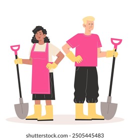 Man and woman are standing in gardening clothes and holding a spade