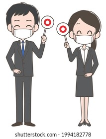 A man and woman in suits wearing masks and holding the correct tag.