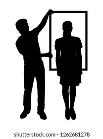 A man and a woman are taking picture with picture frame silhouette vector