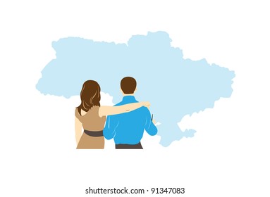 a man and woman together stand examining the map of country