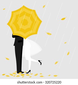 Man and a woman under yellow umbrella.