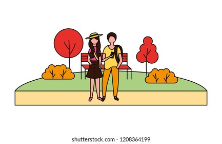 man and woman using mobile in the park