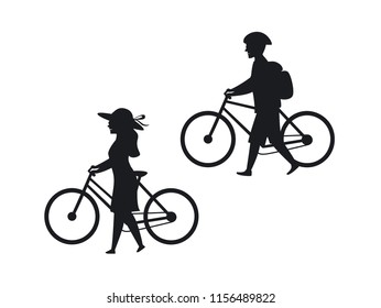 man and woman walking with bicycles silhouettes