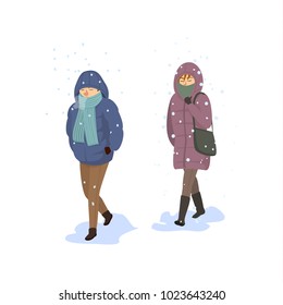 man and woman walking under falling strong snow, extreme cold winter 
