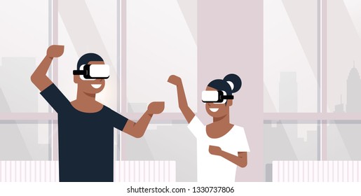 man woman wearing vr glasses african american couple playing virtual reality games dancing together lovers having fun modern apartment interior horizontal portrait