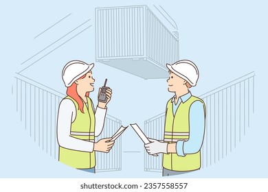 Man and woman work in container port and use walkie-talkie to negotiate with logisticians. Colleagues dressed for industrial job control export and import of goods through port or harbor