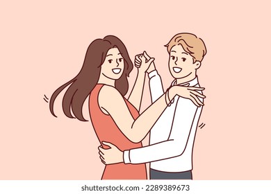 Man and women dancing bachata or salsa wish to become professional latin dancers and embracing partner looking at camera. Happy couple of guys and girls dancing to music in club or on dance floor 