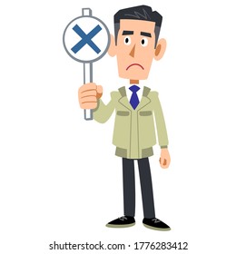 A man in work clothes holding a card with a cross