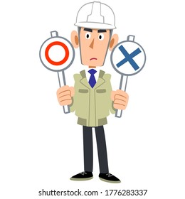 A man in work clothes wearing a helmet holding a circle and a cross in both hands