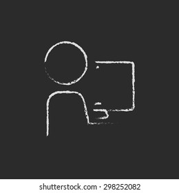 Man working in computer hand drawn in chalk on a blackboard vector white icon on a black background