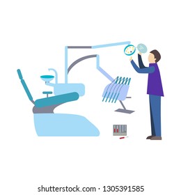 A man in a working form installs a light to a dental unit