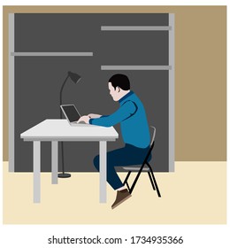 A man is working from home with a laptop in front of him