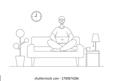 A man working at home on some project, He is sitting on sofa at home in living room and using computer notebook for remote working.