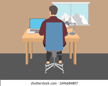 Hombre trabajando en casa. Sentado en una silla que trabaja en un ordenador portátil sobre una mesa de madera y junto a una lámpara de escritorio. Una ventana con montañas y un cielo azul.