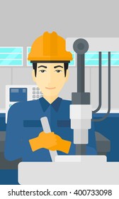 Man working with industrial equipment.