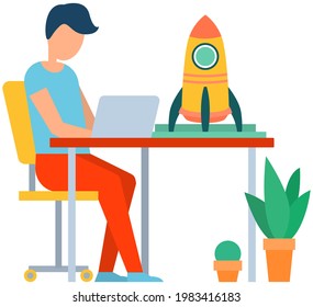 Man working on business startup. Man with laptop works with information. Guy creates new business project, startup with spaceship. Freelancer works sitting at table with small model of rocket