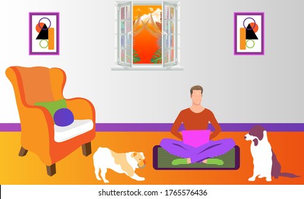 Man working on a computer from home with his pet dogs.