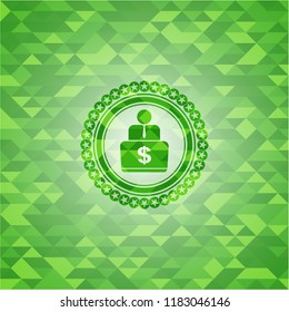 man working on computer icon inside green emblem. Mosaic background