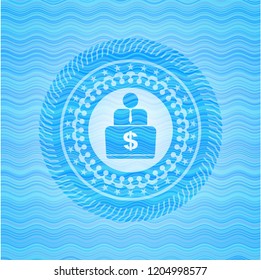 man working on computer icon inside water style emblem.