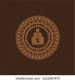 man working on computer icon inside wood emblem