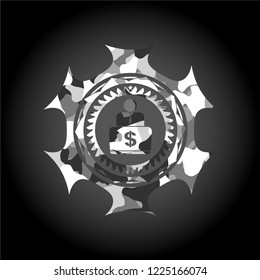 man working on computer icon on grey camo texture