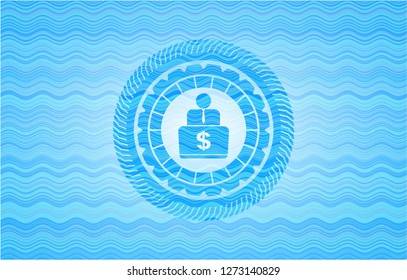 man working on computer icon inside light blue water wave badge background.
