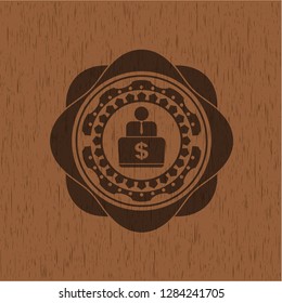 man working on computer icon inside wooden emblem. Retro