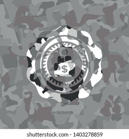 man working on computer icon on grey camouflage pattern