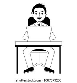 man working on a laptop computer office desk